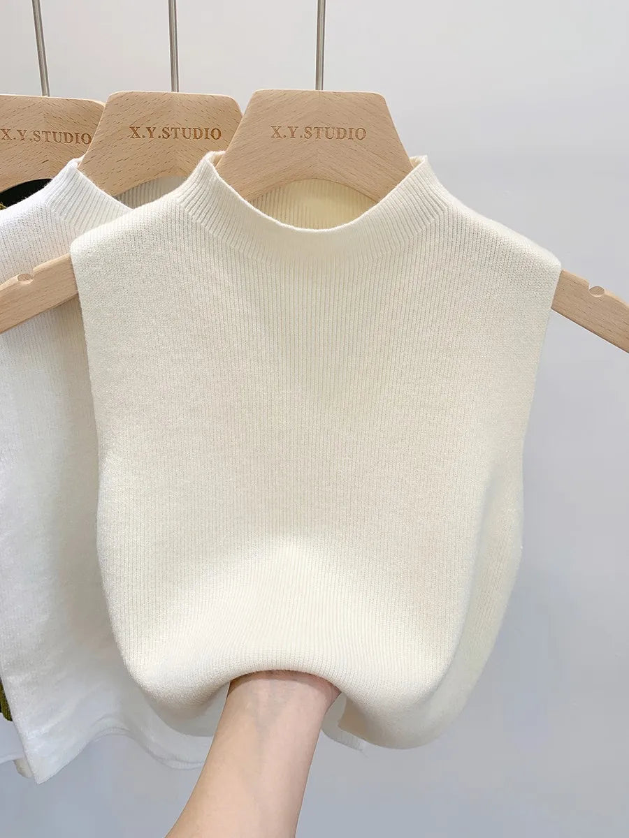Ribbed knitted sleeveless top with stand collar