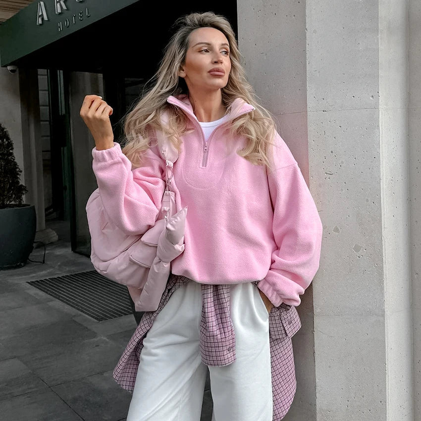 Women's pink fleece pullover with zip-up stand collar and long sleeves