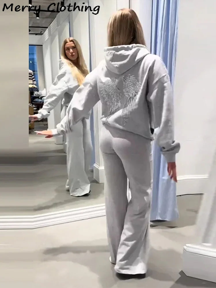 Long-sleeved hoodie with sequin wing motif on the back