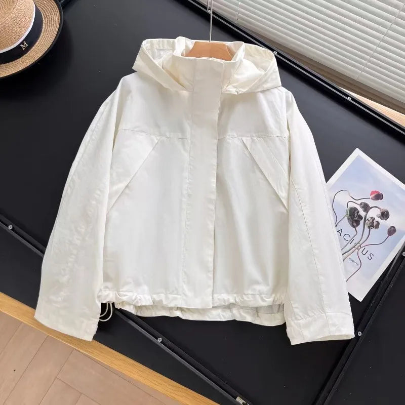 Short women's transitional jacket with hood and stand-up collar