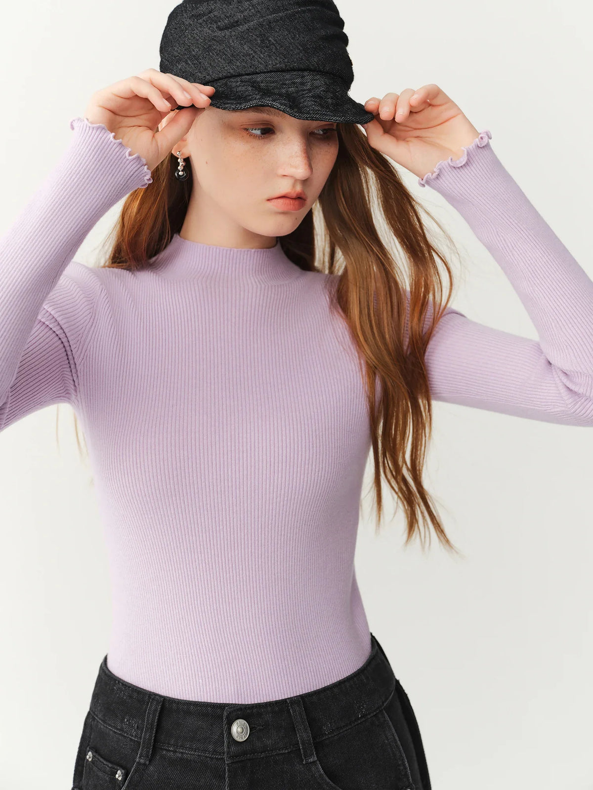 Women's ribbed long-sleeve top with stand collar and ruffled hem
