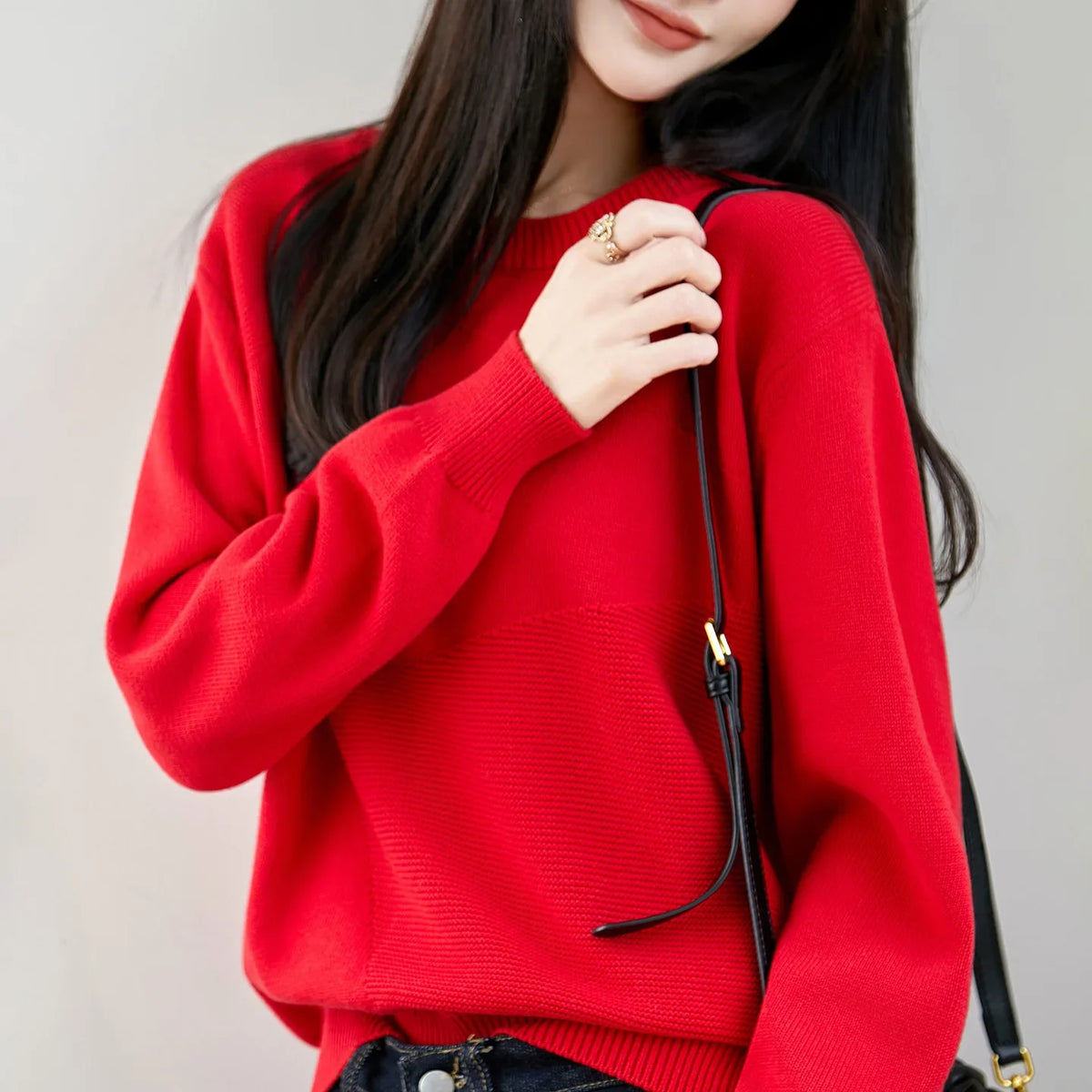 Women's crew-neck long-sleeve knit sweater with textured details