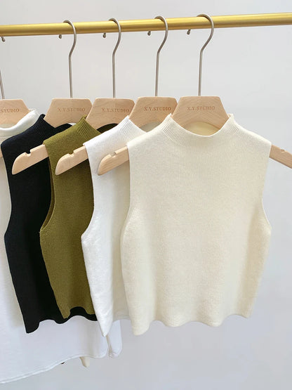 Ribbed knitted sleeveless top with stand collar