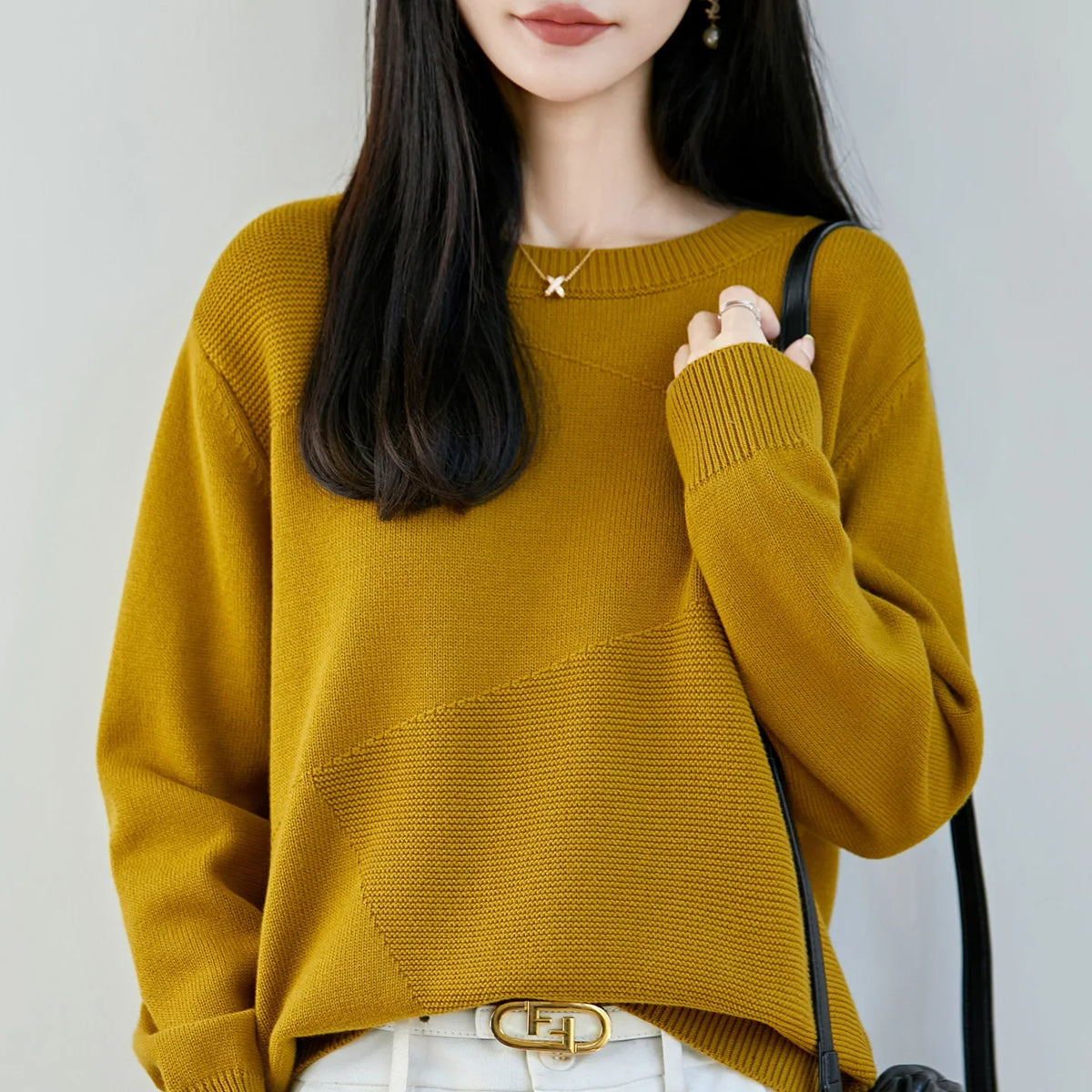 Women's crew-neck long-sleeve knit sweater with textured details