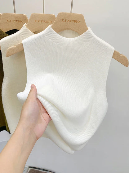 Ribbed knitted sleeveless top with stand collar