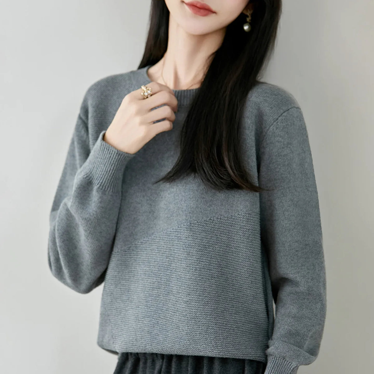 Women's crew-neck long-sleeve knit sweater with textured details