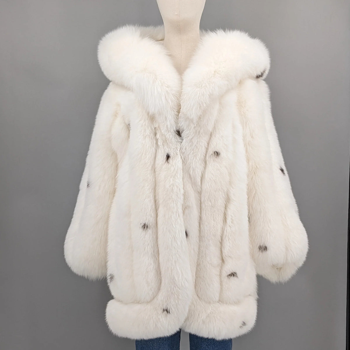 Women's luxurious white coat with hood and dark accents