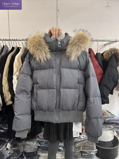 Women's quilted jacket with faux-fur hood and glitter details