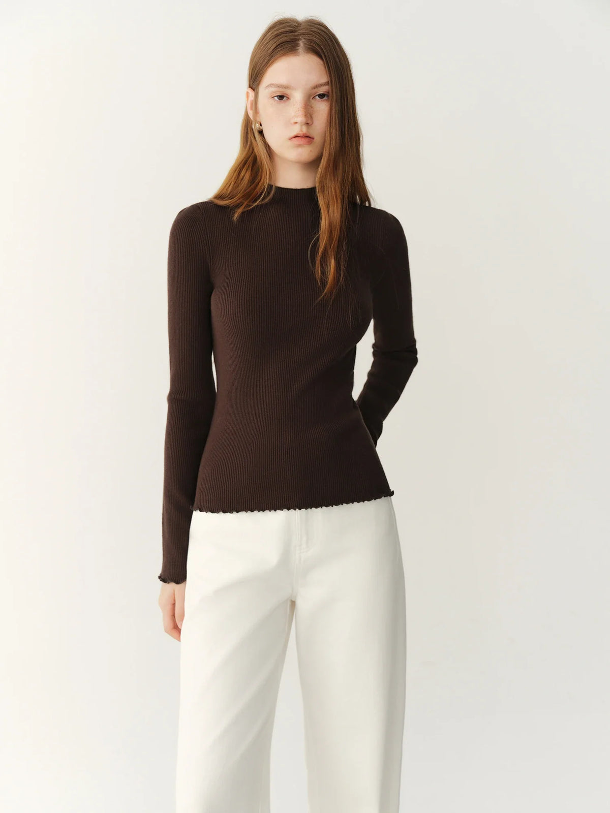 Women's ribbed long-sleeve top with stand collar and ruffled hem