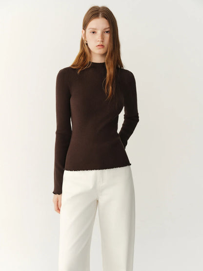 Women's ribbed long-sleeve top with stand collar and ruffled hem