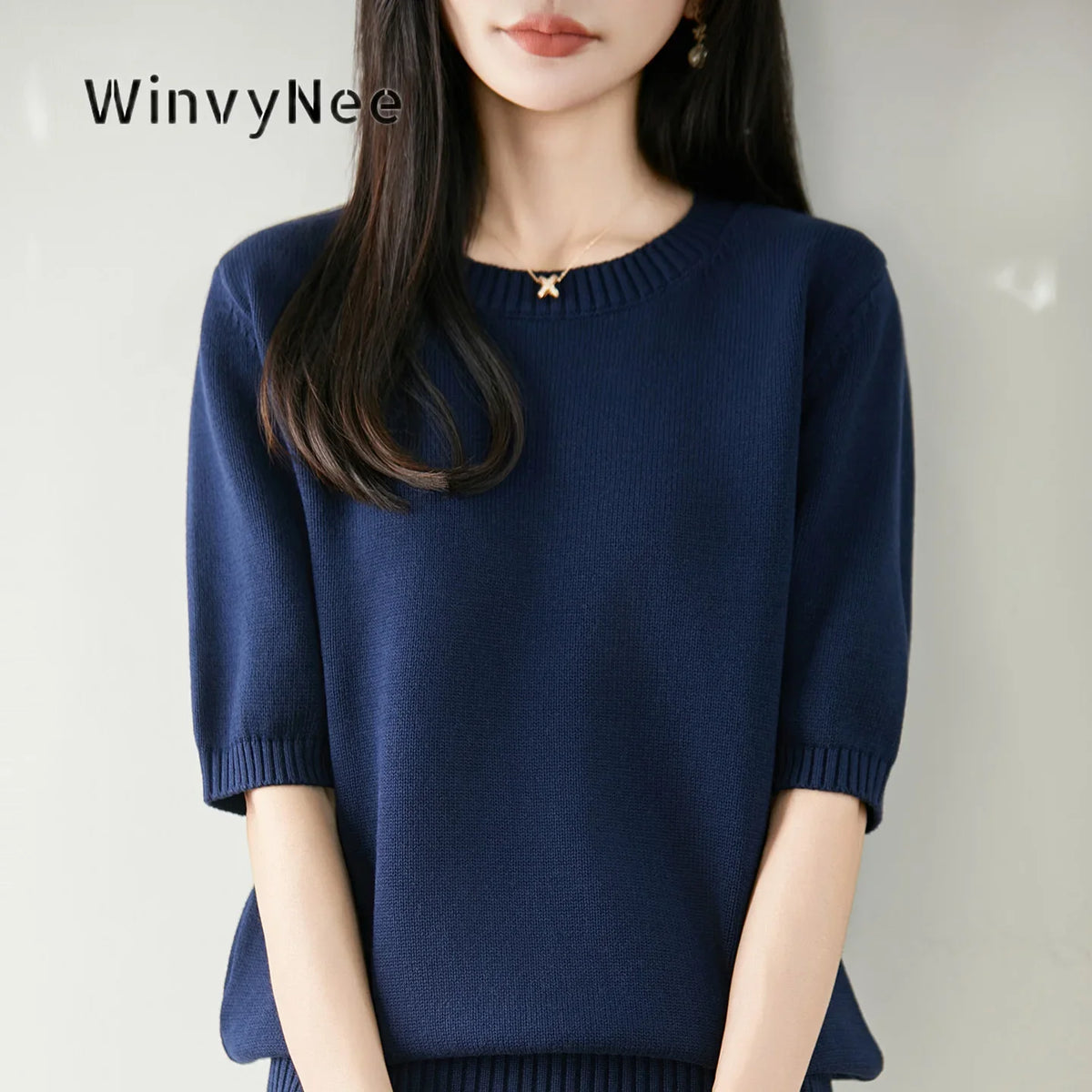 Women's short-sleeve crew-neck knit sweater with ribbed cuffs
