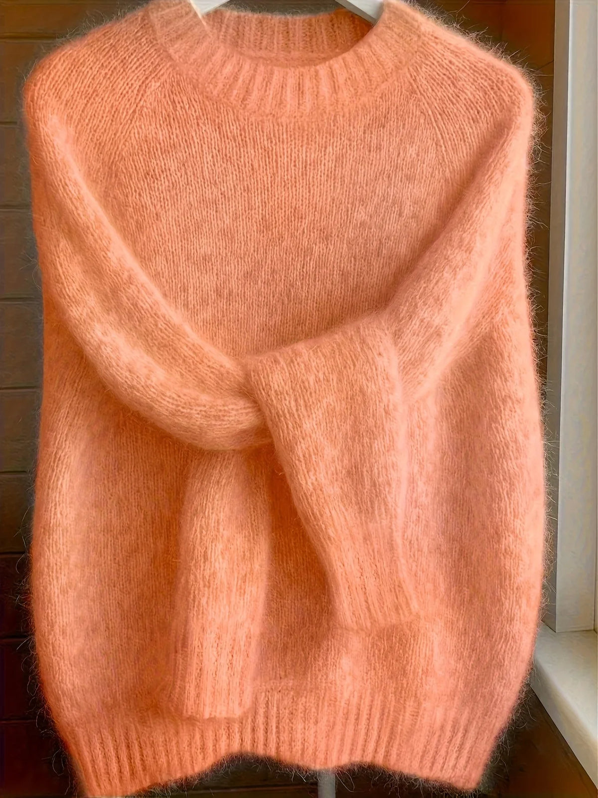 Women's coral sweater with crew neckline