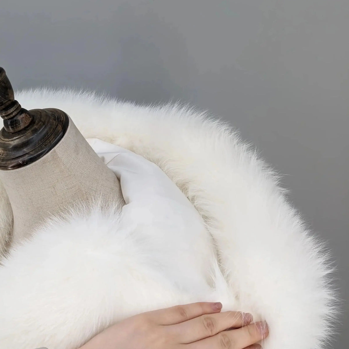 Women's luxurious white coat with hood and dark accents