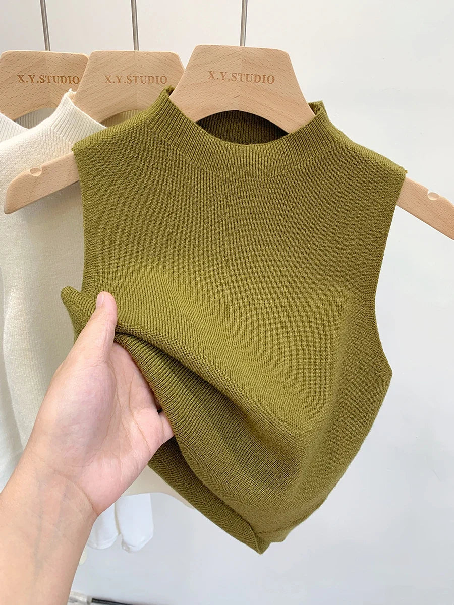 Ribbed knitted sleeveless top with stand collar