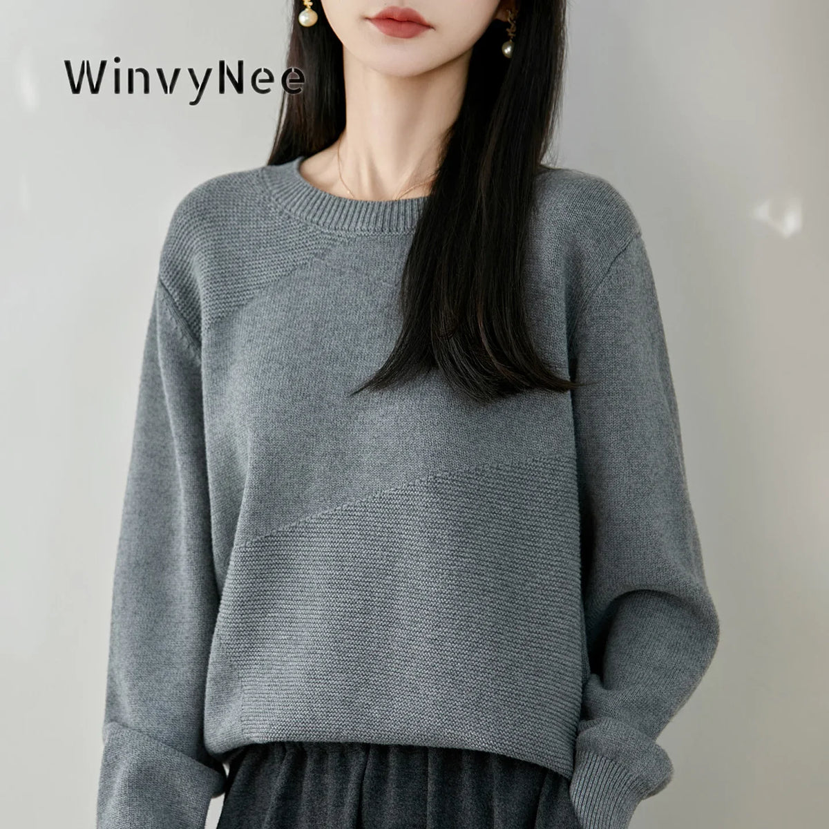 Women's crew-neck long-sleeve knit sweater with textured details