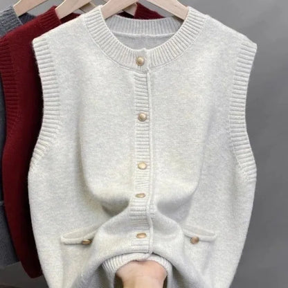 Women's knitted vest with crew neck, button placket, and pockets