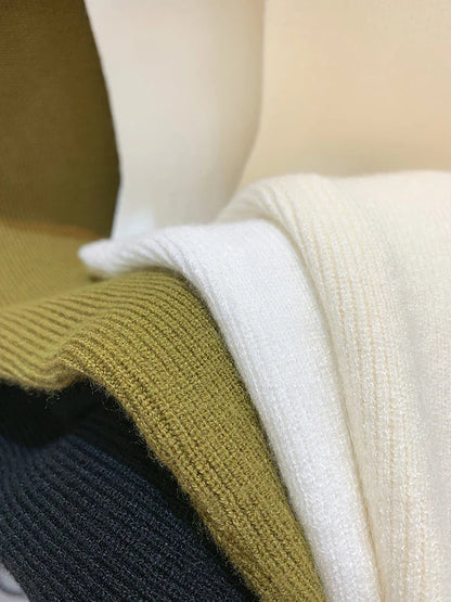 Ribbed knitted sleeveless top with stand collar