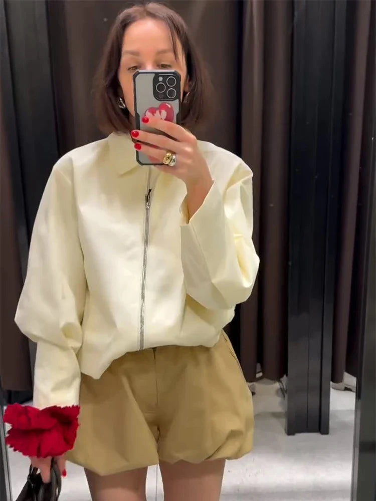 Women's cream-colored jacket with zipper, collar, and wide sleeves
