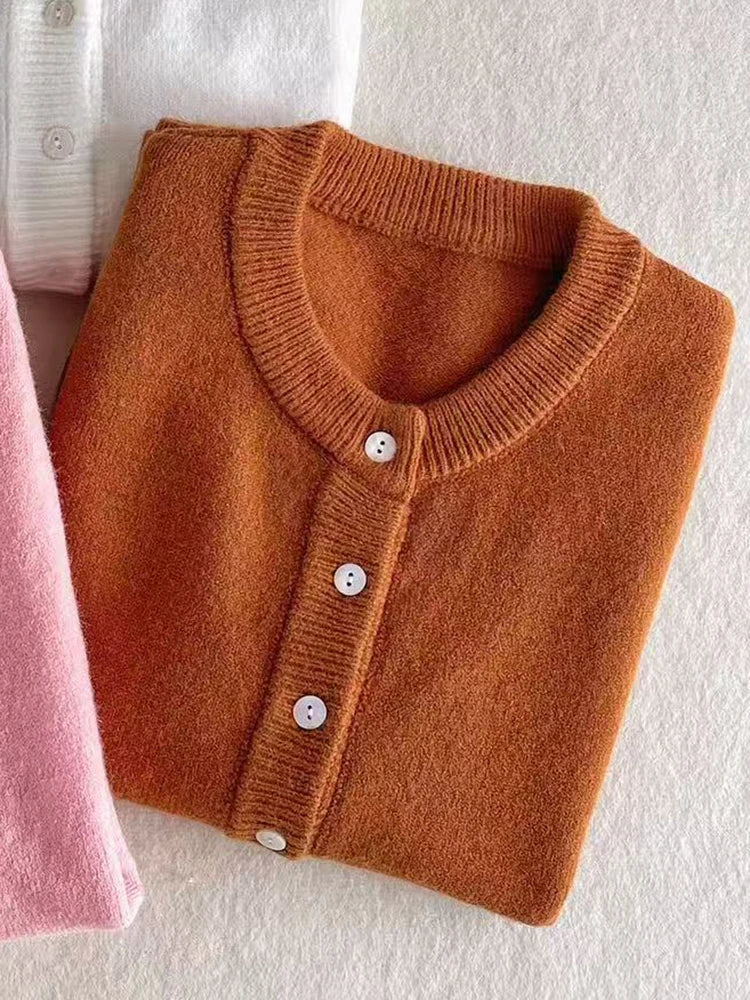 Women's knitted cardigan with round neck and button placket