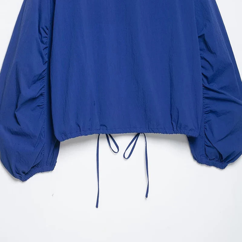 Blue women's blouse with stand-up collar and drawstring hem