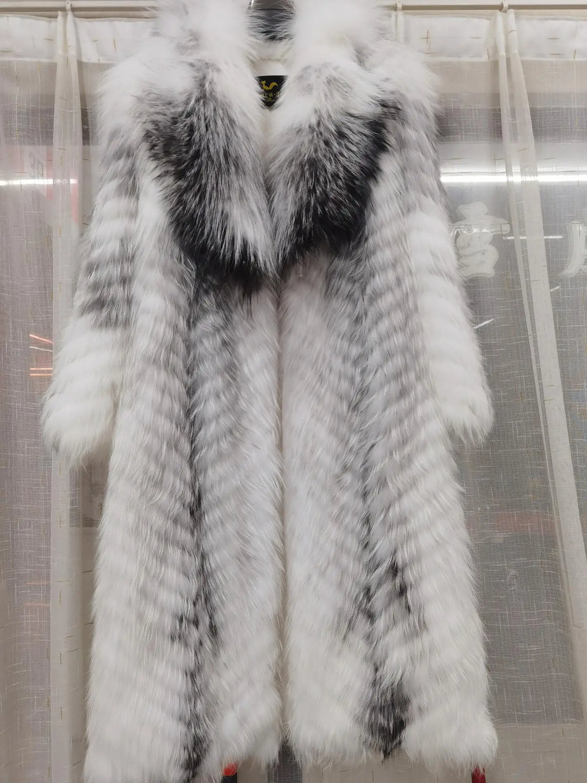 Long women's faux-fur coat with chevron pattern, warm winter coat