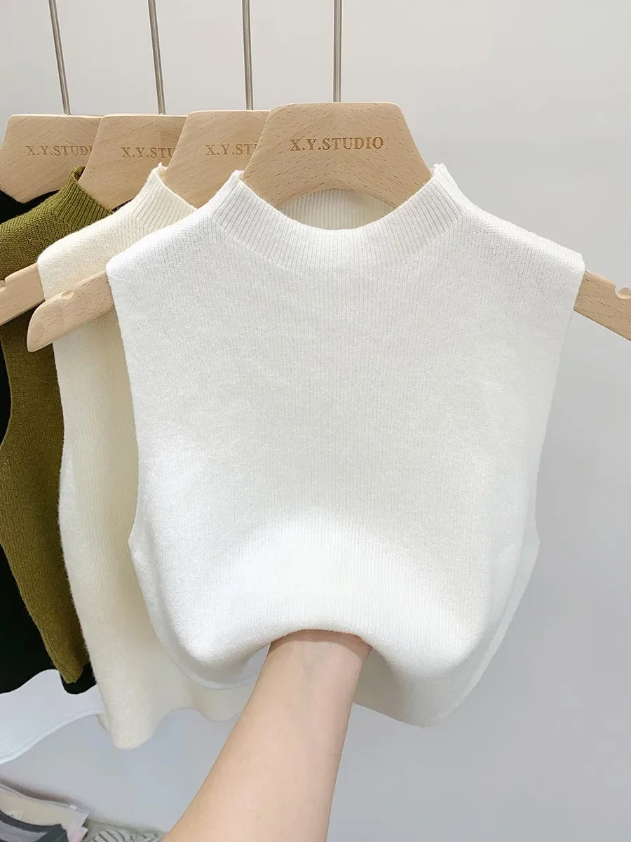 Ribbed knitted sleeveless top with stand collar