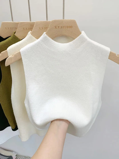 Ribbed knitted sleeveless top with stand collar