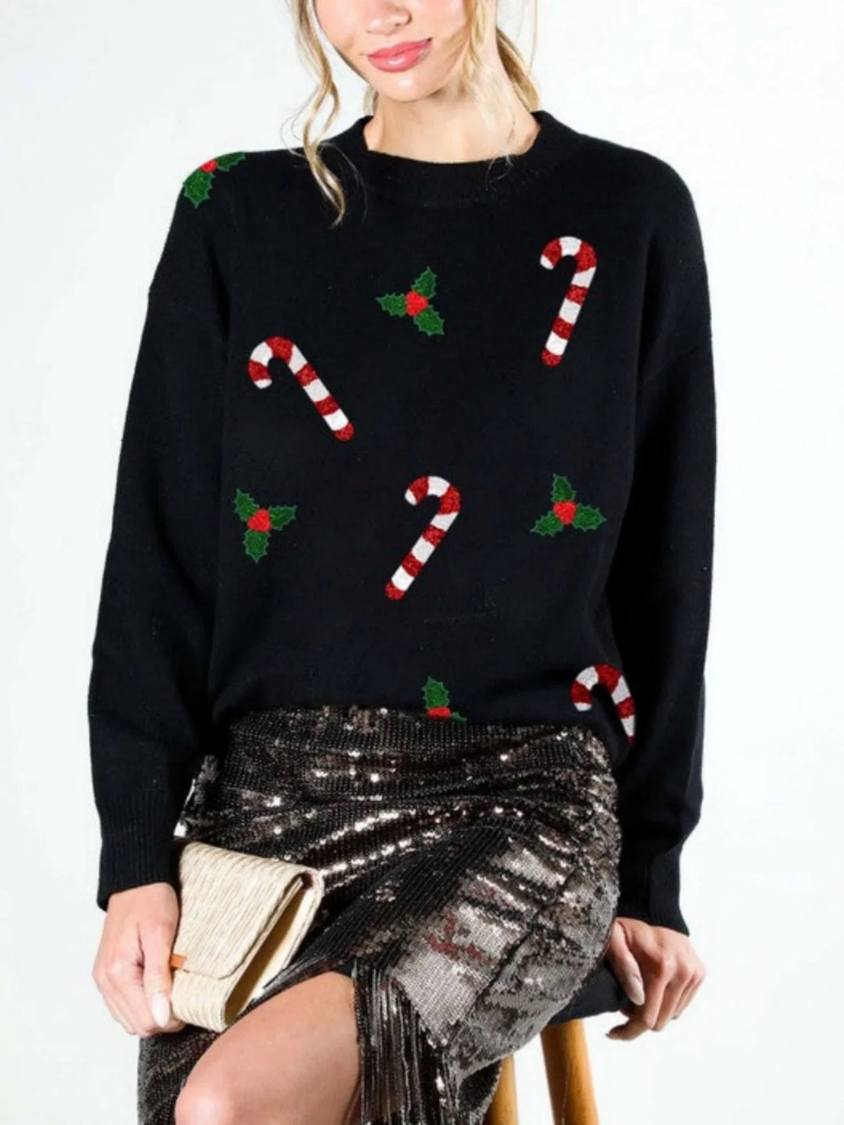 Women's green Christmas sweater with candy cane & holly motif