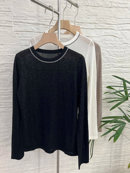 Crew-neck long-sleeve top with contrast stitching, slightly sheer fabric