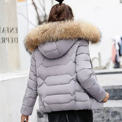 Women's quilted jacket with faux fur hood and zippers