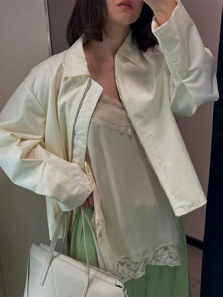 Women's cream-colored jacket with zipper, collar, and wide sleeves