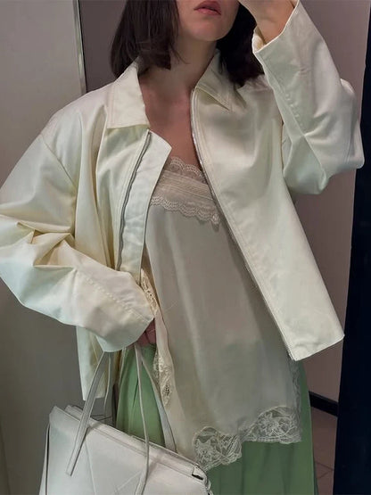 Women's cream-colored jacket with zipper, collar, and wide sleeves