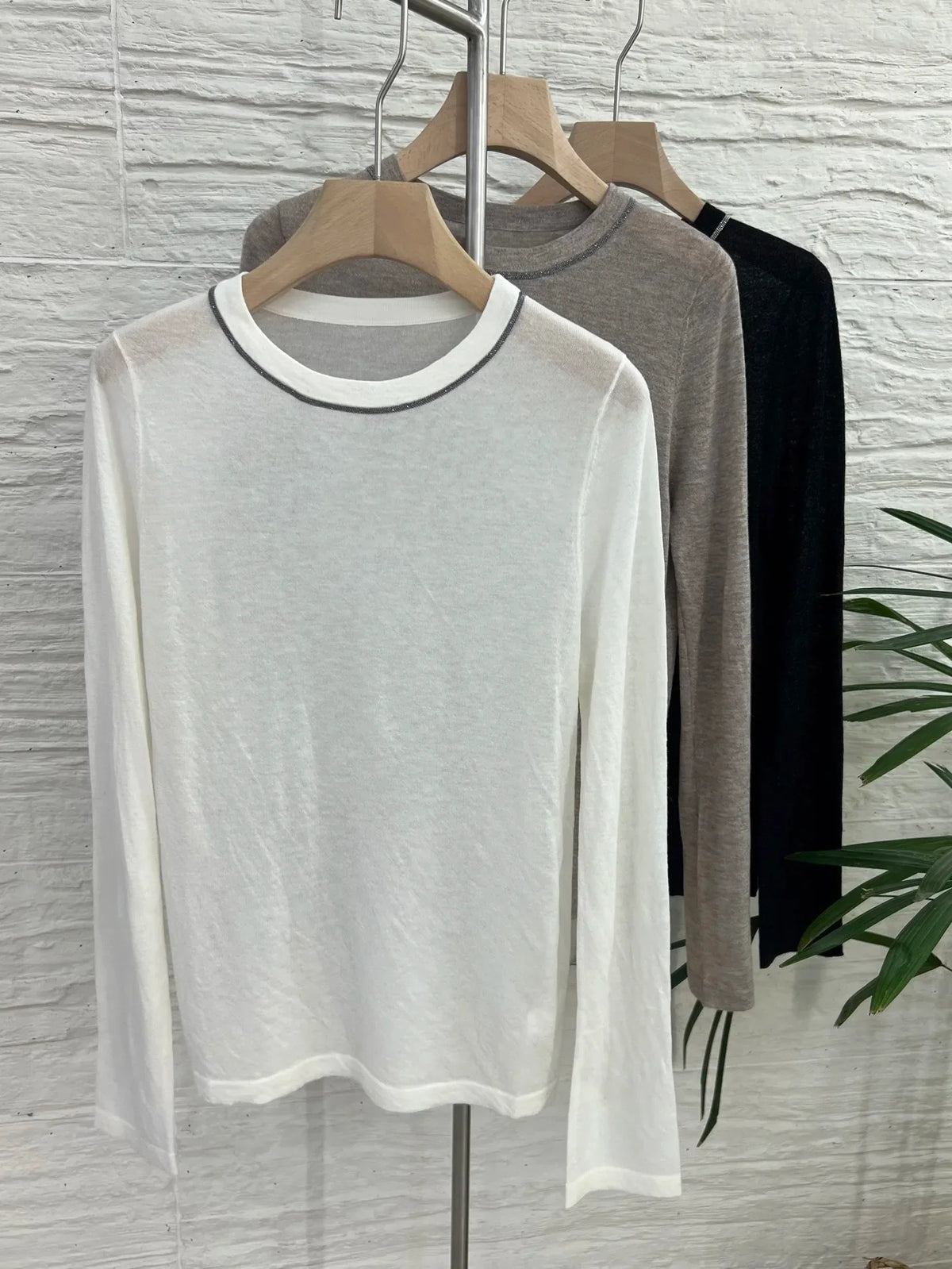 Crew-neck long-sleeve top with contrast stitching, slightly sheer fabric