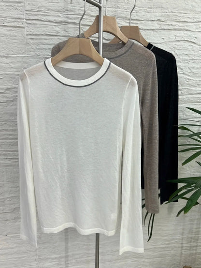 Crew-neck long-sleeve top with contrast stitching, slightly sheer fabric