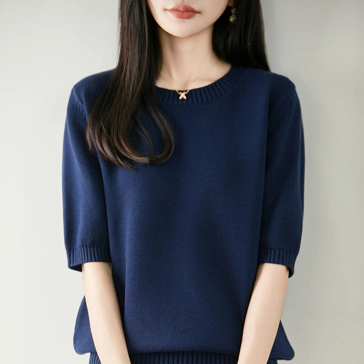 Women's short-sleeve crew-neck knit sweater with ribbed cuffs