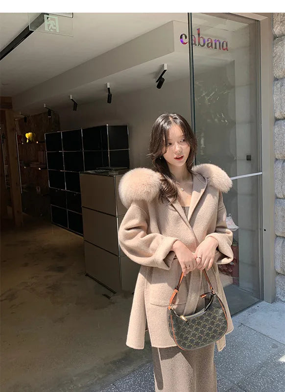 Women's short coat with hood and faux fur pom-poms, belt detail