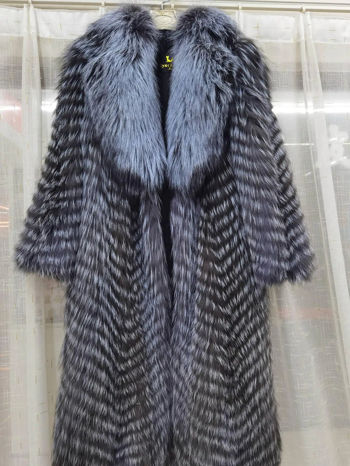 Long women's faux-fur coat with chevron pattern, warm winter coat