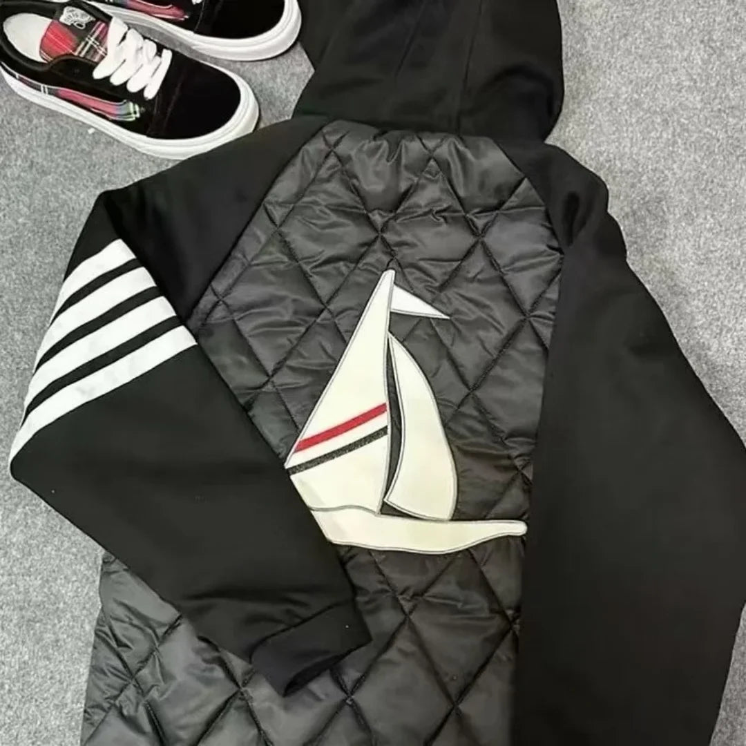 Unisex quilted jacket with hood and sailboat motif, black