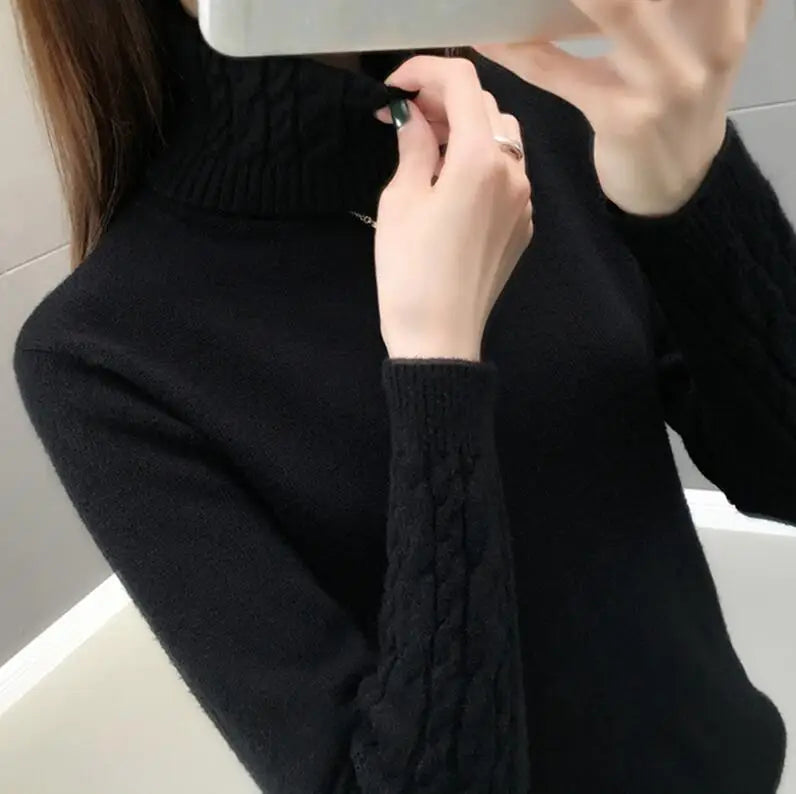 Women's turtleneck knitted sweater with cable-knit sleeves