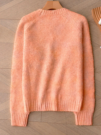 Women's coral sweater with crew neckline