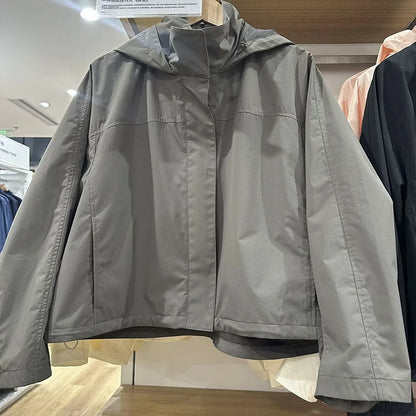 Short women's transitional jacket with hood and stand-up collar