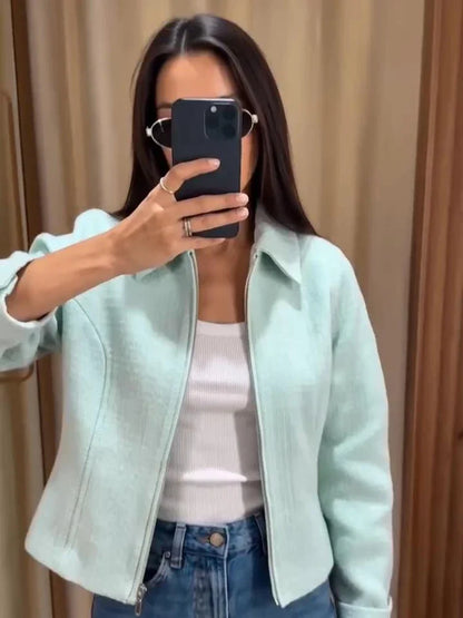 Women's mint green short jacket with zipper, collar, and textured material