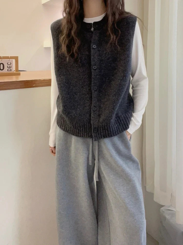 Women's knitted vest with button placket, round neckline, and rib-knit hem