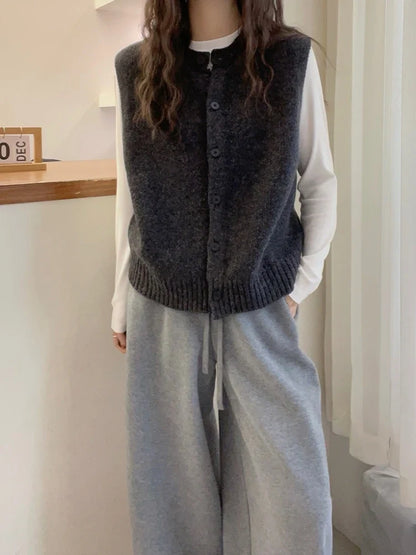 Women's knitted vest with button placket, round neckline, and rib-knit hem