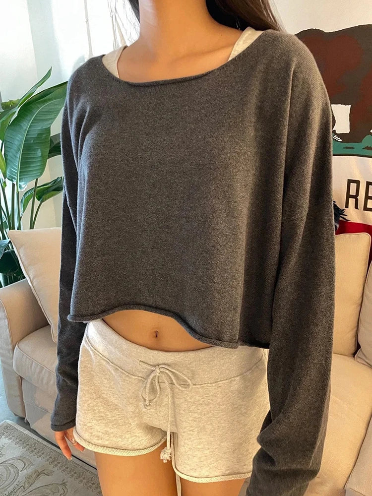 Women's cropped crew-neck long-sleeve pullover with raw edges