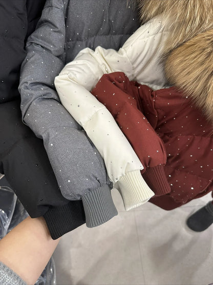 Women's quilted jacket with faux-fur hood and glitter details