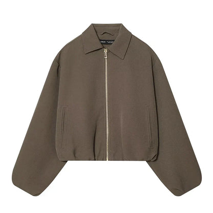 Short women's bomber jacket with collar, zipper, and long sleeves