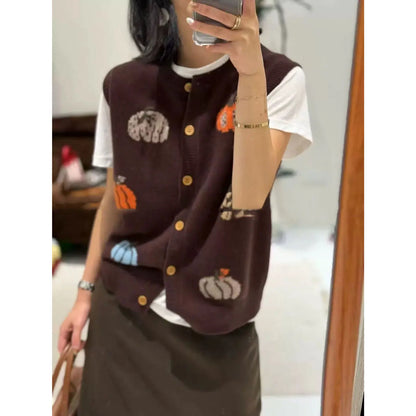 Women's knitted vest with pumpkin motifs, button placket, and round neckline