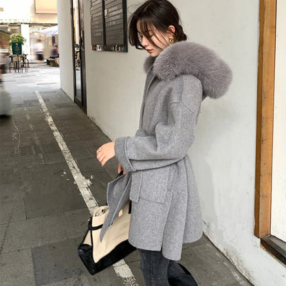 Women's short coat with hood and faux fur pom-poms, belt detail