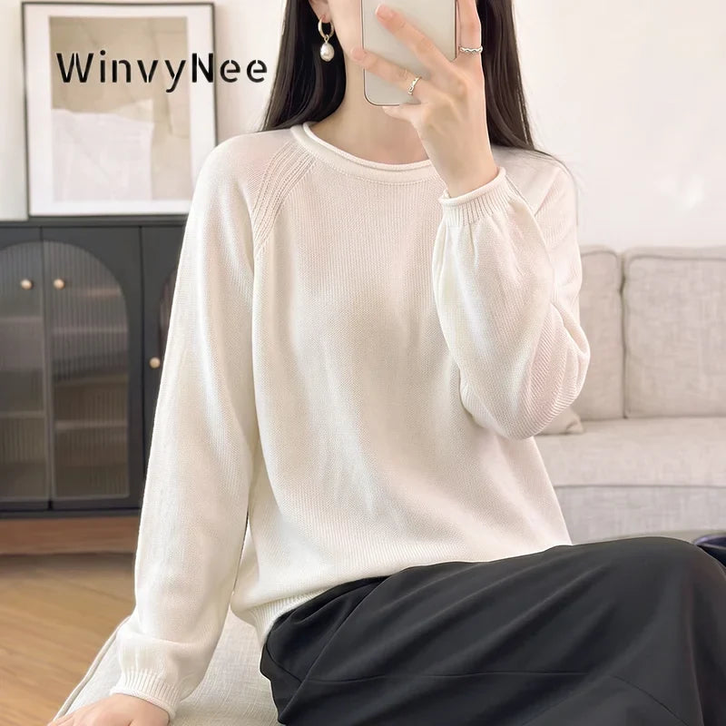 Women's crew-neck long-sleeve knit sweater with raglan sleeves and cuffs